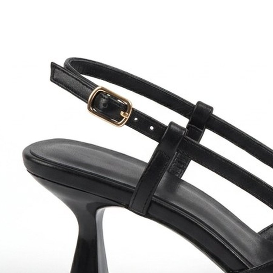 The small gold buckle on the slingback strap
